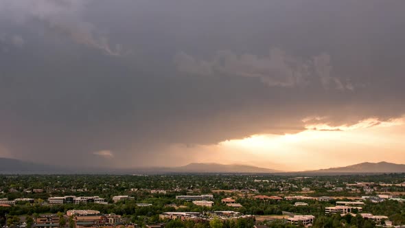 Time lapse of sun rays shining over Utah Valley during storm