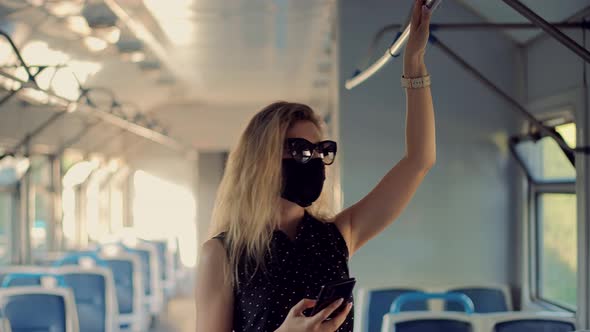 Girl In Face Mask Protection Epidemic Coronavirus On Public Transport. Female In Face Mask On Tram.