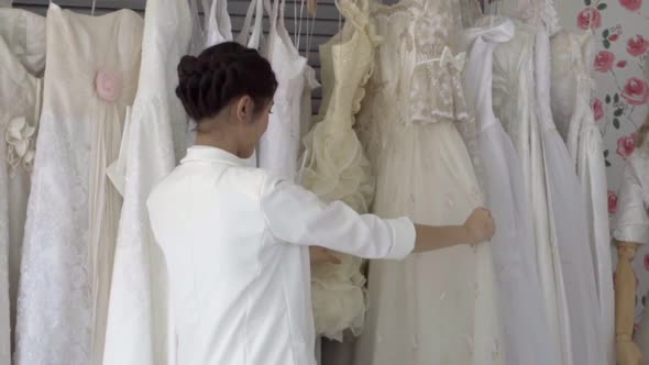 Future Bride Choosing Wedding Dress for Her Upcoming Wedding Ceremony