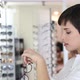 Health Care Eyesight and Vision Concept  Happy Woman Choosing Glasses at Optics Store - VideoHive Item for Sale