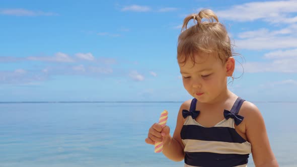 Adorable Little Girl on Warm and Sunny Summer Day in Positano Town in Italy on Amalfi Coast