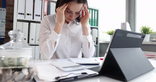 Tired Woman with Headache at the Workplace in Office