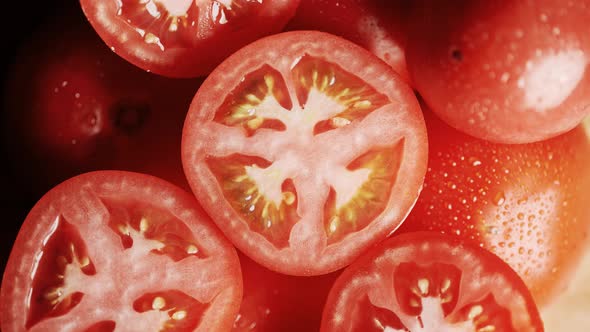 Slow Motion of Rotation Ripe Red Sliced Tomatoes