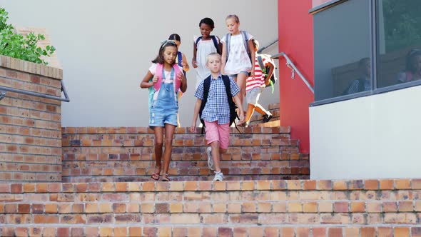 School kids walking on staircase