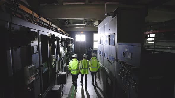 Industrial Engineers Walking in Manufacturing Plant Discussing New Project or Production Plan