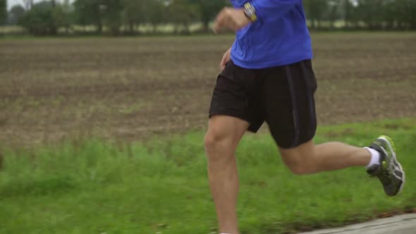 Jogging Man in Slow Motion From Legs up to Face