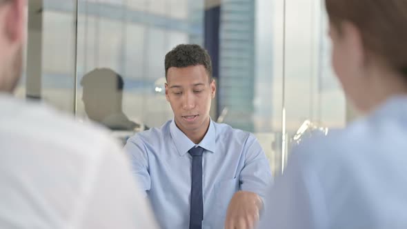 Rear Back View of Couple Having Meeting with Ambitious Businessman 