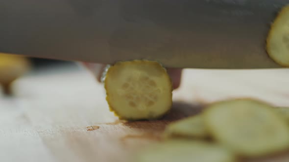 Cutting Dill Pickle into Slices