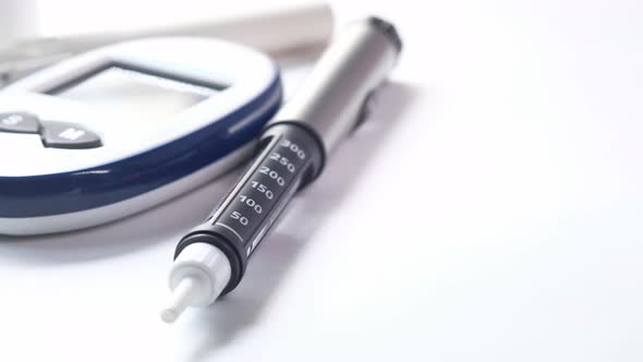 Insulin Pens on White Background, Close Up 