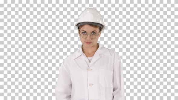 Young woman engineer in hard hat walking, Alpha Channel