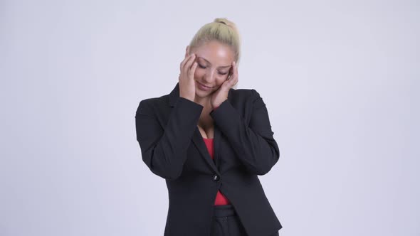 Young Stressed Blonde Businesswoman Having Headache