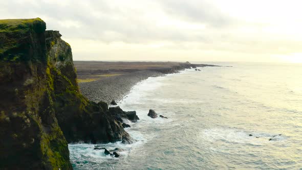 Ocean Waves Crashing On Rocky Shore Of Beach In Iceland. - aerial