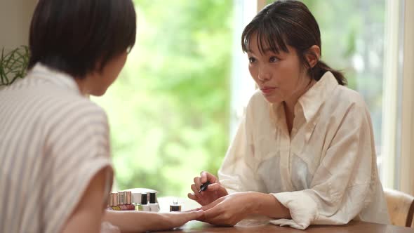 woman doing nails