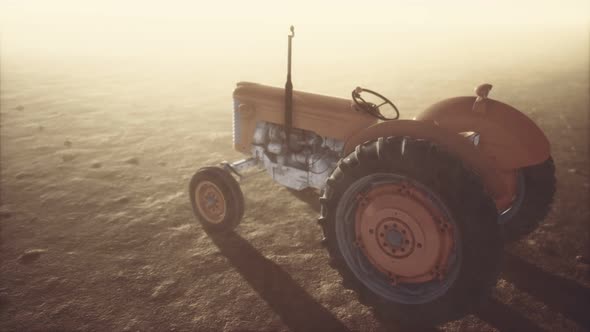 Vintage Retro Tractor on a Farm in Desert