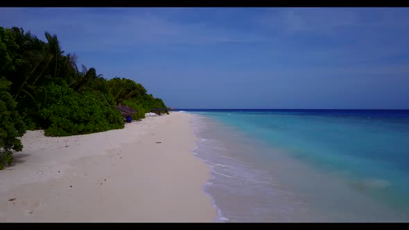 Aerial top view scenery of beautiful coastline beach vacation by blue lagoon with white sandy backgr