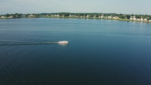 Aerial Drone Shot Tracking a Boat in a Quiet Harbor (Norwalk, Connecticut)