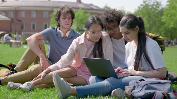 Group of Diverse Young People Studying Together Outside University