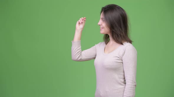 Young Happy Beautiful Woman Showing Something