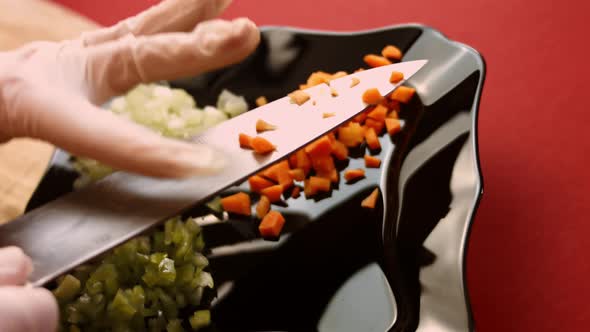 Chef Cuts Carrots for Salad with a Sharp Knife