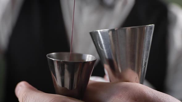 The Bartender Cooks the Cocktail. A Man Mixes Ingredients with Each Other, for the Right Taste