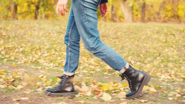 Girl Tourist on a Hike in the Autumn Forest