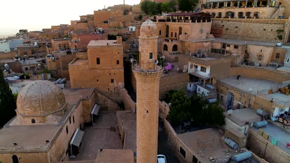 Minaret Of A Mosque And Stone Houses