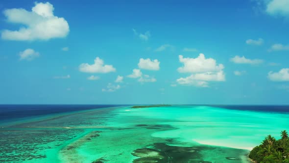 Aerial top down scenery of perfect lagoon beach journey by blue ocean with white sandy background of