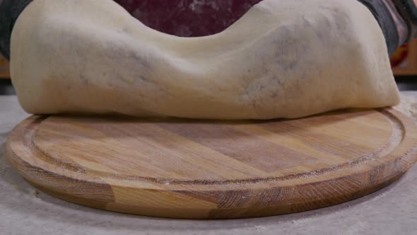 Close Up View of a Man Chef Cooking Italian Pizza. The Process of Making Pizza at Table . Fresh