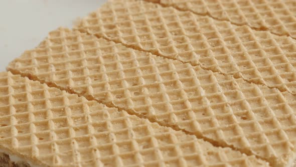 Sweet thin biscuit waffle surface pattern  close-up 4K 21560p 30fps UltraHD slow pan footage - Israe