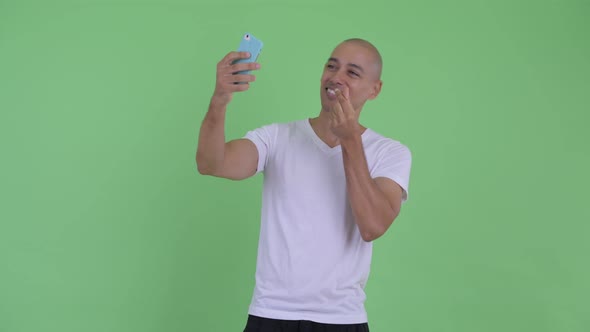 Happy Handsome Bald Man Taking Selfie