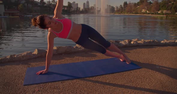 Woman Doing Yoga In The Park At Dawn