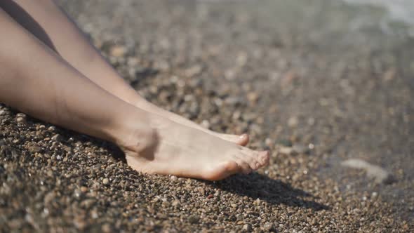 Close Up of Woman Feet on Beach.