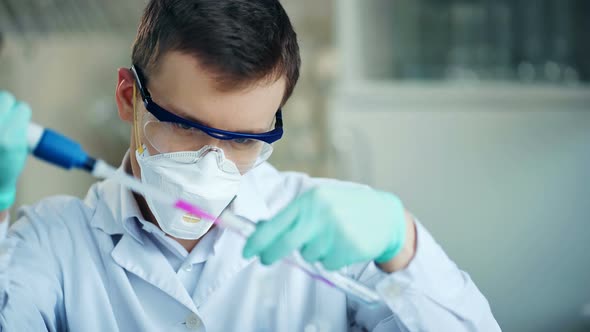 Researcher with Tube and Dropper in the Modern Lab