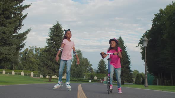 Lovely Active Sisters Enjoying Leisure in Park