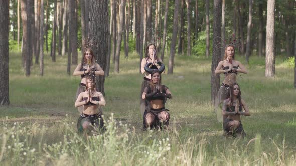 Group of Women Dancers with Make-up and in Mystical Costumes Dancing