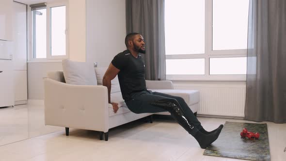 Determined Male Fit Sportsman Exercising at Home