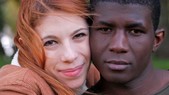 Portrait Of young attractive Happy Mixed Race Couple in the park