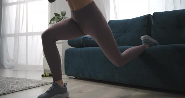 Sporty Slim Woman Is Training in Room Athletic Lady Is Doing Exercises for Legs Muscles Closeup of