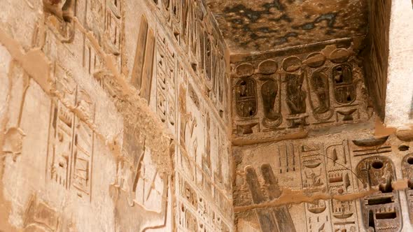 Detail of ancient Egyptian hieroglyphs on a wall, Habu Temple, Luxor, Egypt.