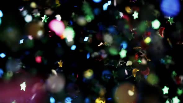 Multicolored Confetti Flying After Being Exploded Particles Flying and Falling Down Black Background