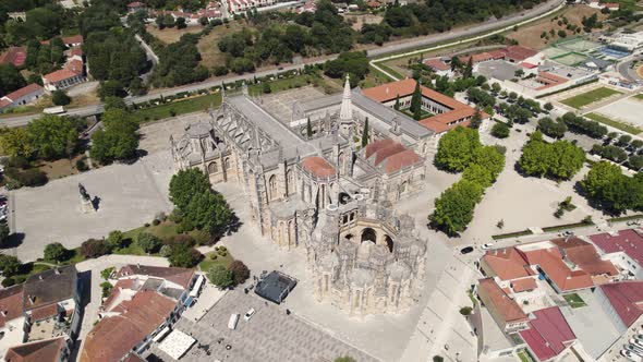 Aerial approaching Batalha Monastery, Leiria, Portugal. Gothic architecture landmark