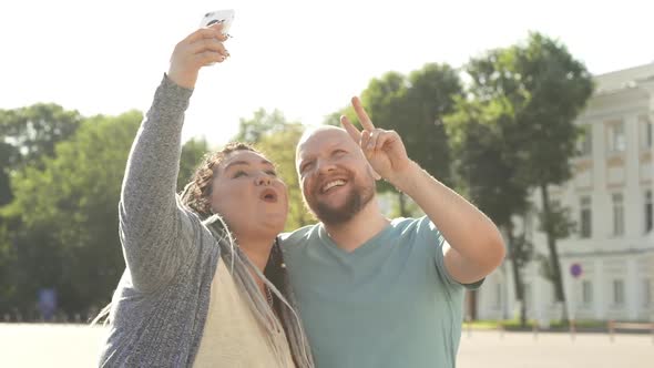 Concept of Lifestyle, Friendship and Urban Holidays. Happy Diverse Friends Taking Selfie at City