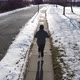 Man running on sidewalk in snow - VideoHive Item for Sale