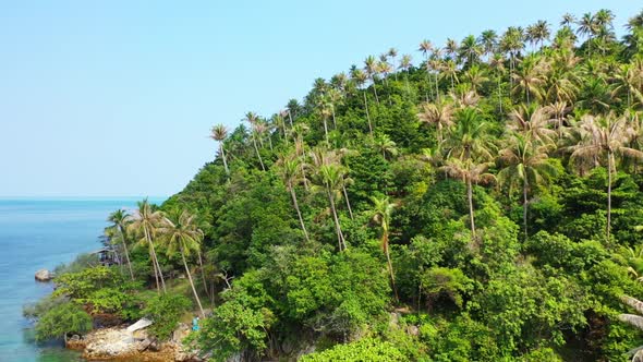 Aerial seascape of perfect resort beach holiday by turquoise sea and white sand background of a dayo