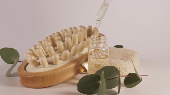 Eucalyptus Oil with Leaves on a White Background