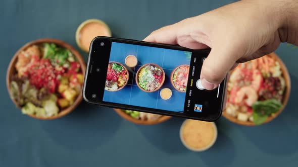 Taking Photo of Hawaiian Poke Bowls Using Smartphone Top View