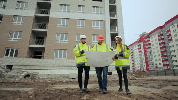 Building Inspection of New Construction Object Two Male Foreman and Female Architect in Building