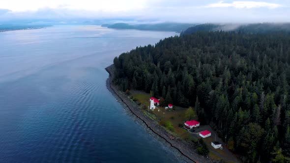 Vancouver Island Canada Quadra Island Old Historical Lighthouse at Cape Mudge Couple in Yellow Rain