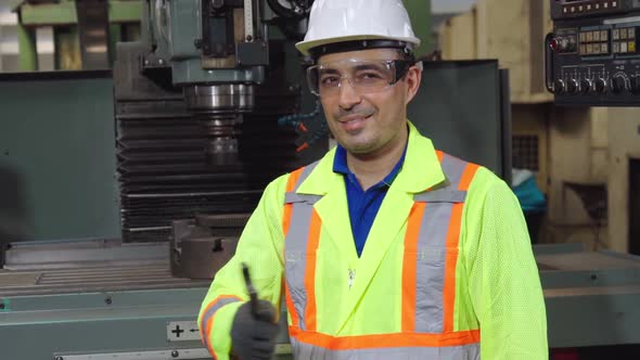 Young Factory Worker or Engineer Close Up Portrait in Factory