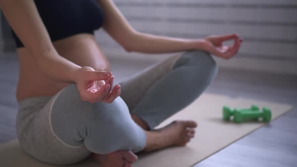 Pregnant Woman Sit on Lotus Pose and Meditate Do Yoga Exercise Touch Hand Finger Spbd